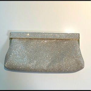Soft gold metallic clutch